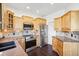 Well-lit kitchen featuring stainless steel appliances, light wood cabinets, and sleek countertops at 7340 Brightwaters Ct, New Port Richey, FL 34652
