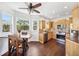 Open kitchen and dining area with maple cabinets, stainless appliances, and natural light at 7340 Brightwaters Ct, New Port Richey, FL 34652