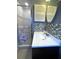 Bathroom featuring a gray accent wall, modern vanity, and glass door shower at 7534 Briarwood Dr, Port Richey, FL 34668