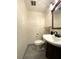 Bathroom featuring neutral paint, modern vanity, and standard toilet at 7534 Briarwood Dr, Port Richey, FL 34668