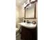 Bathroom featuring neutral paint, modern vanity, and standard toilet at 7534 Briarwood Dr, Port Richey, FL 34668