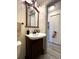 Bathroom featuring neutral paint, modern vanity, and standard toilet at 7534 Briarwood Dr, Port Richey, FL 34668