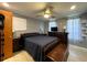 Cozy bedroom with neutral walls, ceiling fan, and a dark wood bedroom set at 7534 Briarwood Dr, Port Richey, FL 34668