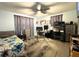 Bedroom with wooden floors, ceiling fan, curtains, and furniture at 7534 Briarwood Dr, Port Richey, FL 34668