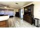 Living room view of kitchen island and backyard access at 7534 Briarwood Dr, Port Richey, FL 34668