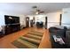 Open-concept living room flowing into the dining area with hardwood floors and lots of natural light at 7534 Briarwood Dr, Port Richey, FL 34668