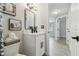 Stylish bathroom with a modern vanity, black fixtures, and decorative art at 7545 Banner St, New Port Richey, FL 34653