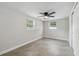 Bright and airy bedroom with tile floors, neutral walls and natural light at 7545 Banner St, New Port Richey, FL 34653