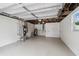 Spacious garage interior with epoxy floors and white walls at 7545 Banner St, New Port Richey, FL 34653