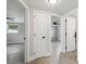 Hallway with tile floors and doors to several rooms at 7545 Banner St, New Port Richey, FL 34653