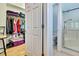 The bathroom features a glass shower enclosure and is connected to a walk in closet at 8149 Ambersweet Pl, Land O Lakes, FL 34637