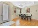 Dining room with lots of natural light features wood floors and stylish chandelier lighting fixture at 8149 Ambersweet Pl, Land O Lakes, FL 34637