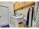 Laundry room features large capacity washer and dryer and lots of storage space at 8149 Ambersweet Pl, Land O Lakes, FL 34637