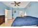 Spacious main bedroom featuring light blue walls and an ensuite bathroom at 8149 Ambersweet Pl, Land O Lakes, FL 34637
