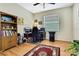 The office features wood floors, neutral paint, and a large window for natural light at 8149 Ambersweet Pl, Land O Lakes, FL 34637