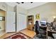 The office features wood floors, neutral paint, and a closet for storage at 8149 Ambersweet Pl, Land O Lakes, FL 34637