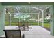 The covered patio features outdoor furniture for relaxing outside at 8149 Ambersweet Pl, Land O Lakes, FL 34637