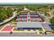 Aerial view of the community courts, including tennis, pickleball, and basketball at 8248 Sugarbush Dr, Spring Hill, FL 34606