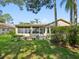 A charming backyard showcasing a patio and serene landscaping, perfect for outdoor relaxation at 8248 Sugarbush Dr, Spring Hill, FL 34606