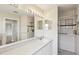 Clean bathroom featuring a walk-in shower, bright vanity, and modern fixtures at 8248 Sugarbush Dr, Spring Hill, FL 34606