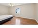 Bright bedroom with hardwood flooring and a large window for natural light at 8248 Sugarbush Dr, Spring Hill, FL 34606