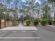 Exterior shot of the community's fenced dog park area with shade at 8248 Sugarbush Dr, Spring Hill, FL 34606