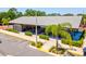 Exterior view of a community picnic pavilion with picnic tables and charcoal grills at 8248 Sugarbush Dr, Spring Hill, FL 34606