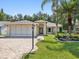 Charming single-story home with a well-manicured lawn and inviting curb appeal at 8248 Sugarbush Dr, Spring Hill, FL 34606
