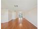 Open living room showcasing hardwood floors, ceiling fan, and contemporary light fixture at 8248 Sugarbush Dr, Spring Hill, FL 34606