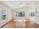Living room featuring hardwood floors and multiple windows offering plenty of natural light at 8248 Sugarbush Dr, Spring Hill, FL 34606