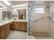 Bathroom with double sinks, and a shower at 8283 Shoup St, Spring Hill, FL 34606