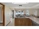 Bright eat-in kitchen area featuring tiled floors and sliding glass doors to the exterior at 8283 Shoup St, Spring Hill, FL 34606