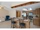 Open kitchen and living area with a breakfast bar and stainless appliances at 8283 Shoup St, Spring Hill, FL 34606