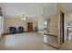 Spacious living room with tile flooring, ceiling fan, and ample natural light at 8283 Shoup St, Spring Hill, FL 34606
