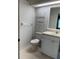 Cozy bathroom with white vanity and light tile floor at 8291 Weeping Willow St, Brooksville, FL 34613