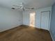 Bright bedroom with ceiling fan, closet and view of ensuite bathroom at 8291 Weeping Willow St, Brooksville, FL 34613