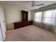 Well-lit bedroom featuring built-in shelving for storage and a ceiling fan at 8291 Weeping Willow St, Brooksville, FL 34613
