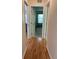 Hallway with wood flooring leading to bedrooms at 8291 Weeping Willow St, Brooksville, FL 34613