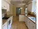 Spacious kitchen boasts granite countertops, white cabinets, and stainless appliances at 8291 Weeping Willow St, Brooksville, FL 34613