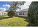 Large, well-maintained backyard with lush green grass and mature landscaping at 9529 Bunker Hill Ct # 9529, New Port Richey, FL 34655