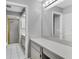 Bathroom featuring a walk-in shower with a gold frame and a large vanity with mirror at 9529 Bunker Hill Ct # 9529, New Port Richey, FL 34655