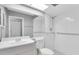 Bright bathroom featuring subway tile, a shower, grab bars, and new fixtures at 9529 Bunker Hill Ct # 9529, New Port Richey, FL 34655