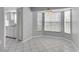 Bright dining area featuring tile flooring and a bay window at 9529 Bunker Hill Ct # 9529, New Port Richey, FL 34655