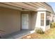 Close-up of a front entrance with a white front door and a bay window at 9529 Bunker Hill Ct # 9529, New Port Richey, FL 34655