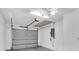 Spacious garage with a garage door, ample lighting, and circuit breaker box at 9529 Bunker Hill Ct # 9529, New Port Richey, FL 34655