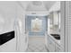 Kitchen with white cabinets, stainless steel appliances, and tile flooring at 9529 Bunker Hill Ct # 9529, New Port Richey, FL 34655