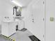 Functional laundry room with washer, dryer, water heater, and ample space at 9529 Bunker Hill Ct # 9529, New Port Richey, FL 34655