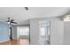 Open living room with hardwood floors, a ceiling fan, and plenty of natural light at 9529 Bunker Hill Ct # 9529, New Port Richey, FL 34655