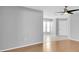 Bright, neutral living room showcasing hardwood and tile flooring at 9529 Bunker Hill Ct # 9529, New Port Richey, FL 34655