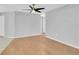 Open-concept living room featuring hardwood floors and ample natural light at 9529 Bunker Hill Ct # 9529, New Port Richey, FL 34655